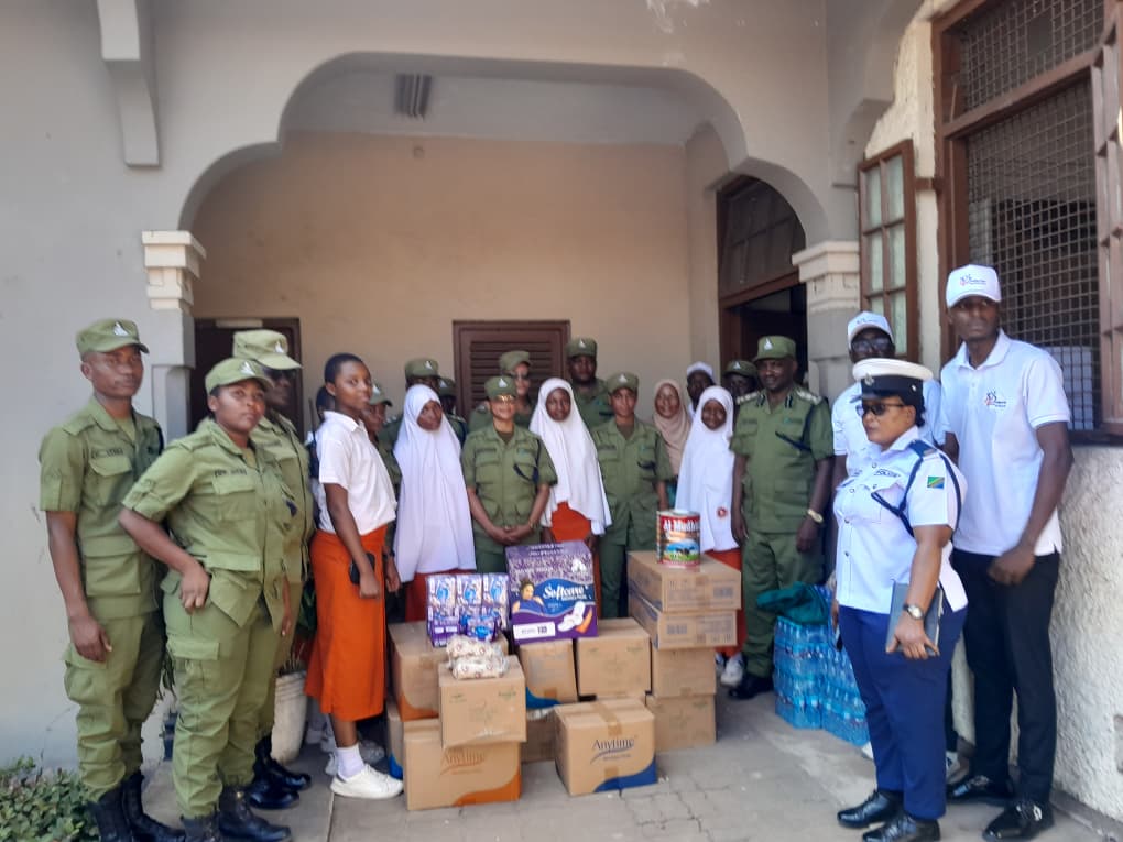 Students together with Kanga Foundation Tanzania representatives and Tanzania Police Force officers during the Jangwani Secondary School donation event